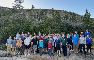The Troop 185 Expedition outside the hut on Sunday evening. The steep trail up Mr. Pierce is the background. Photo credit: Phoebe the Hutmaster